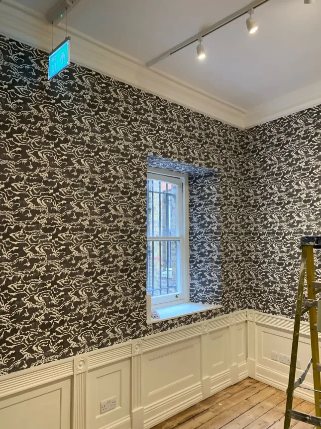grey busy wallpaper on the wall