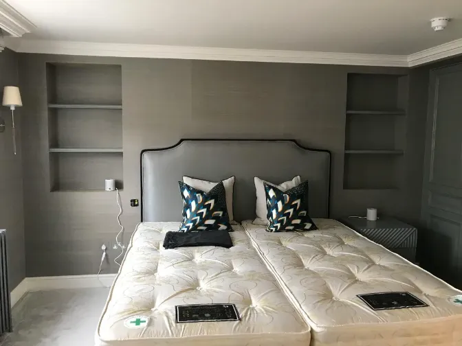 bedroom dark gray wallpaper on the walls, bed