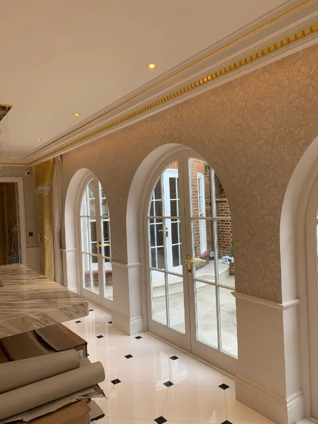 hall image, light tiles on the floor, wallpaper on the walls, large three glazed doors